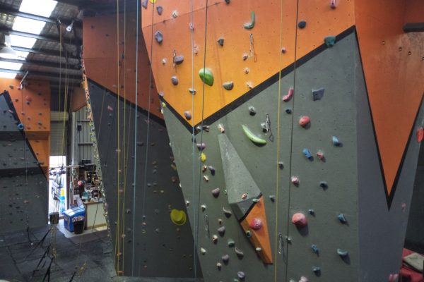 A landscape shot taken from the second floor of our gym in Hume, showing several of our climbing walls.