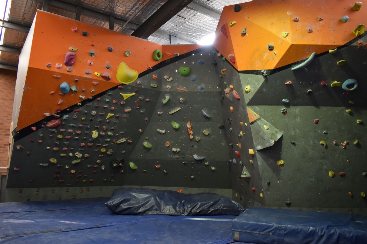 Our Mitchell gym has an upstairs area dedicated entirely to bouldering, with a variety of wall shapes and steepness.